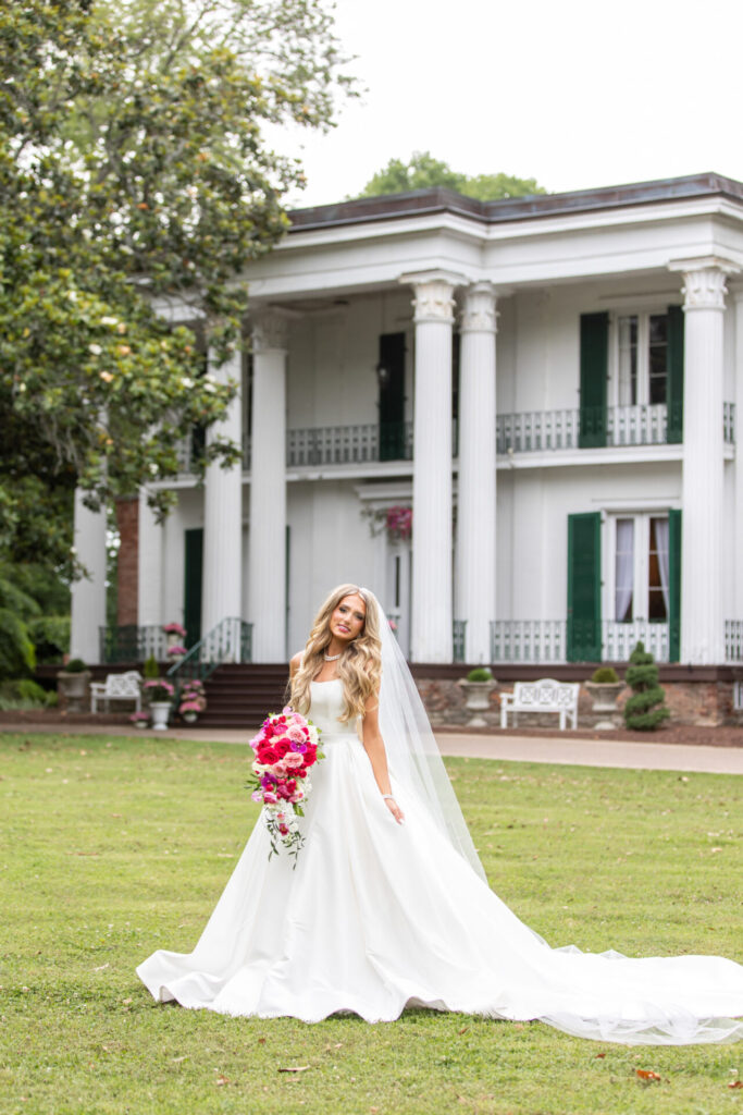 stunning blonde bride in front of southern mansion outside of nashville