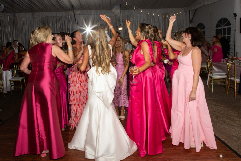 Pink wedding reception with all guests wearing pink