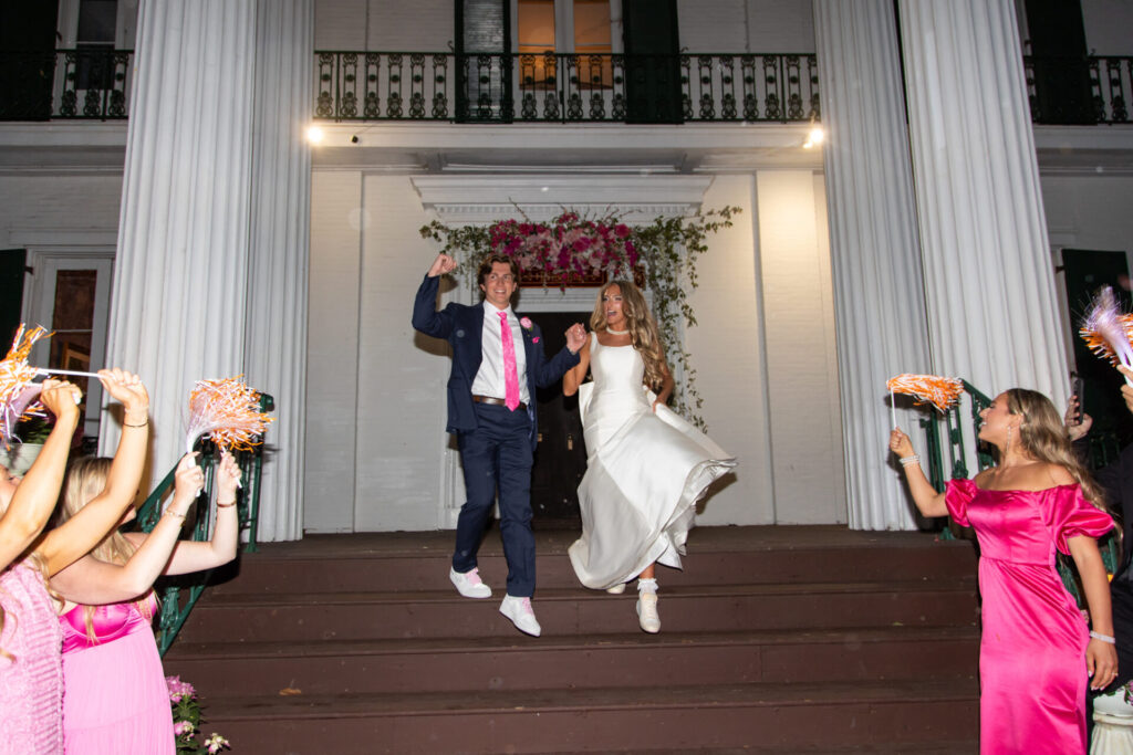 Riverwood Mansion grand exit and farewell to guests with pom poms orange and white for Tennessee